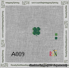 A taped needlepoint canvas with the design: Circle Four Leaf Clover.