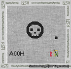 A taped needlepoint canvas with the design: Circle Skull White on Black.