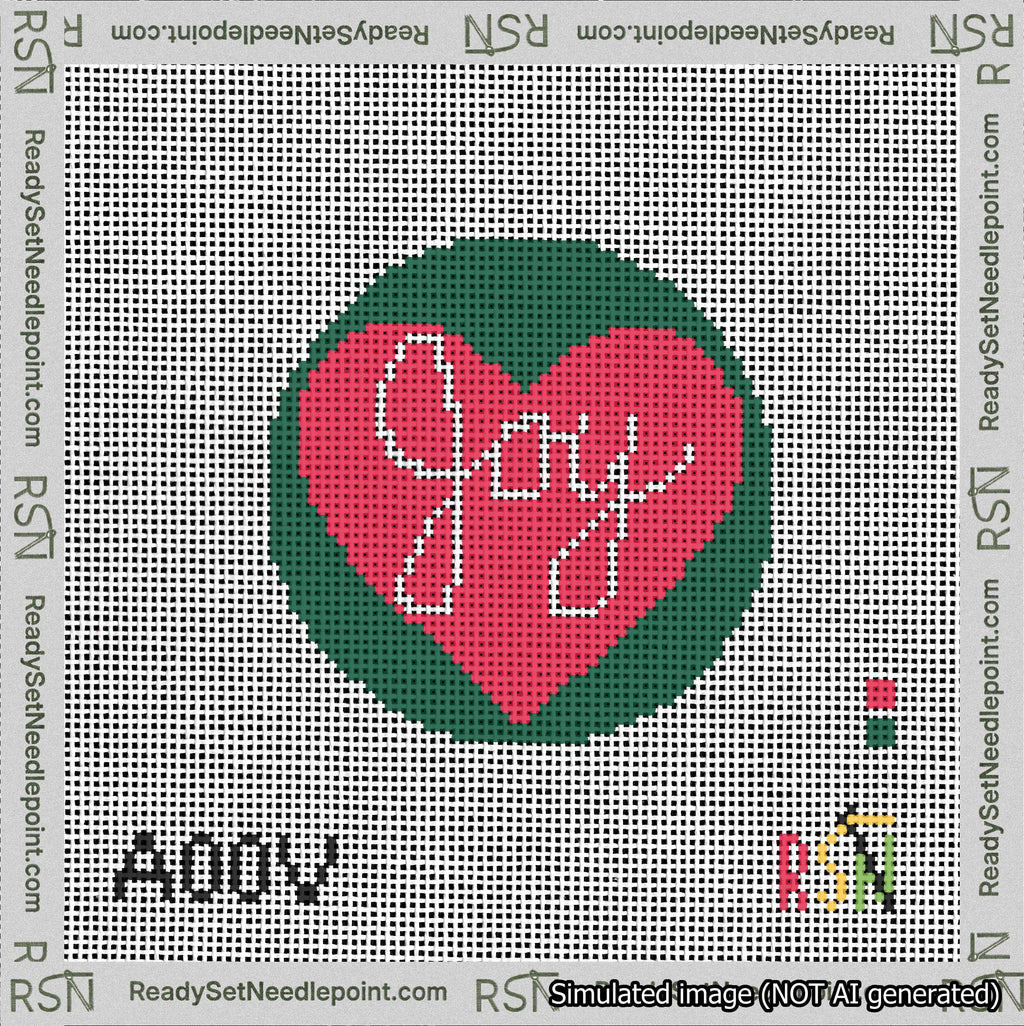 A taped needlepoint canvas with the design: Joy Heart Circle.