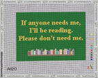 A taped needlepoint canvas with the design: Reading Please Dont Need Me.