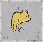A taped needlepoint canvas with the design: Classic Winnie-the-Pooh Stuck Face Out White Background.