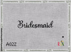 A taped needlepoint canvas with the design: Bridesmaid Bag Insert.