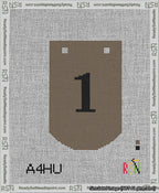 A taped needlepoint canvas with the design: Banner 13 mesh count Curved 1 Black on Brown.