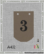 A taped needlepoint canvas with the design: Banner 13 mesh count Curved 3 Black on Brown.