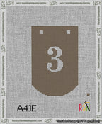 A taped needlepoint canvas with the design: Banner 13 mesh count Curved 3 White on Brown.