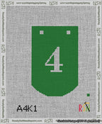A taped needlepoint canvas with the design: Banner 13 mesh count Curved 4 White on Green.