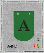 A taped needlepoint canvas with the design: Banner 13 mesh count Curved A Black on Green.