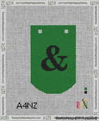 A taped needlepoint canvas with the design: Banner 13 mesh count Curved Ampersand Black on Green.