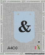 A taped needlepoint canvas with the design: Banner 13 mesh count Curved Ampersand Black on Light Blue.