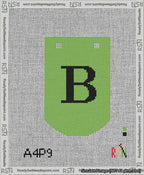 A taped needlepoint canvas with the design: Banner 13 mesh count Curved B Black on Light Green.