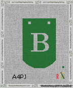 A taped needlepoint canvas with the design: Banner 13 mesh count Curved B White on Green.