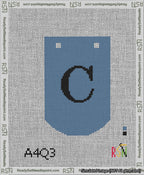 A taped needlepoint canvas with the design: Banner 13 mesh count Curved C Black on Blue.