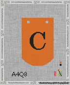 A taped needlepoint canvas with the design: Banner 13 mesh count Curved C Black on Orange.