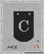 A taped needlepoint canvas with the design: Banner 13 mesh count Curved C White on Black.