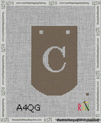 A taped needlepoint canvas with the design: Banner 13 mesh count Curved C White on Brown.