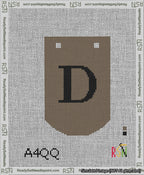 A taped needlepoint canvas with the design: Banner 13 mesh count Curved D Black on Brown.