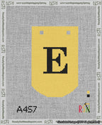 A taped needlepoint canvas with the design: Banner 13 mesh count Curved E Black on Yellow.
