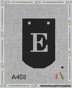 A taped needlepoint canvas with the design: Banner 13 mesh count Curved E White on Black.