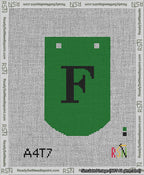 A taped needlepoint canvas with the design: Banner 13 mesh count Curved F Black on Green.