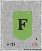 A taped needlepoint canvas with the design: Banner 13 mesh count Curved F Black on Light Green.