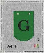 A taped needlepoint canvas with the design: Banner 13 mesh count Curved G Black on Green.