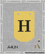 A taped needlepoint canvas with the design: Banner 13 mesh count Curved H Black on Yellow.