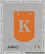A taped needlepoint canvas with the design: Banner 13 mesh count Curved K White on Orange.