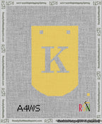 A taped needlepoint canvas with the design: Banner 13 mesh count Curved K White on Yellow.