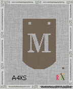 A taped needlepoint canvas with the design: Banner 13 mesh count Curved M White on Brown.