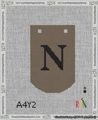 A taped needlepoint canvas with the design: Banner 13 mesh count Curved N Black on Brown.