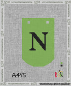 A taped needlepoint canvas with the design: Banner 13 mesh count Curved N Black on Light Green.