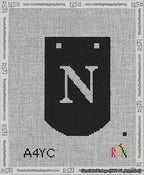A taped needlepoint canvas with the design: Banner 13 mesh count Curved N White on Black.