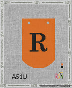 A taped needlepoint canvas with the design: Banner 13 mesh count Curved R Black on Orange.