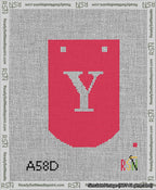 A taped needlepoint canvas with the design: Banner 13 mesh count Curved Y White on Red.