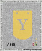 A taped needlepoint canvas with the design: Banner 13 mesh count Curved Y White on Yellow.