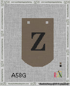 A taped needlepoint canvas with the design: Banner 13 mesh count Curved Z Black on Brown.
