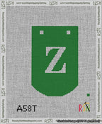A taped needlepoint canvas with the design: Banner 13 mesh count Curved Z White on Green.