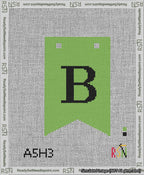 A taped needlepoint canvas with the design: Banner 13 mesh count Forked B Black on Light Green.