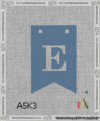 A taped needlepoint canvas with the design: Banner 13 mesh count Forked E White on Blue.