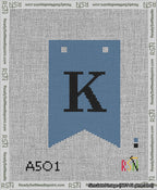 A taped needlepoint canvas with the design: Banner 13 mesh count Forked K Black on Blue.