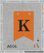 A taped needlepoint canvas with the design: Banner 13 mesh count Forked K Black on Orange.
