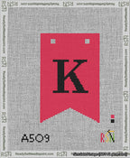 A taped needlepoint canvas with the design: Banner 13 mesh count Forked K Black on Red.