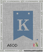A taped needlepoint canvas with the design: Banner 13 mesh count Forked K White on Blue.