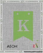 A taped needlepoint canvas with the design: Banner 13 mesh count Forked K White on Light Green.