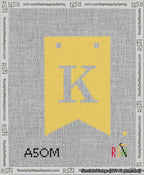 A taped needlepoint canvas with the design: Banner 13 mesh count Forked K White on Yellow.