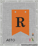 A taped needlepoint canvas with the design: Banner 13 mesh count Forked R Black on Orange.