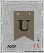 A taped needlepoint canvas with the design: Banner 13 mesh count Forked U Black on Brown.