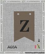 A taped needlepoint canvas with the design: Banner 13 mesh count Forked Z Black on Brown.