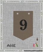 A taped needlepoint canvas with the design: Banner 13 mesh count Pointed 9 Black on Brown.