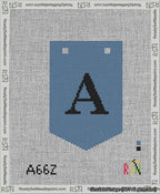 A taped needlepoint canvas with the design: Banner 13 mesh count Pointed A Black on Blue.